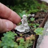 Boy with Shell Statue, Staked